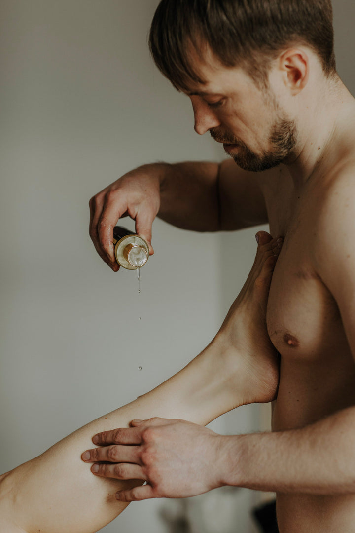 Massage oil for couples man giving a massage