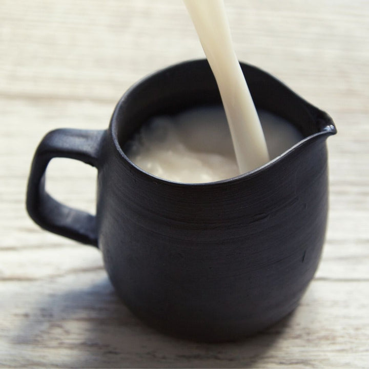 Black pottery milk pitcher 